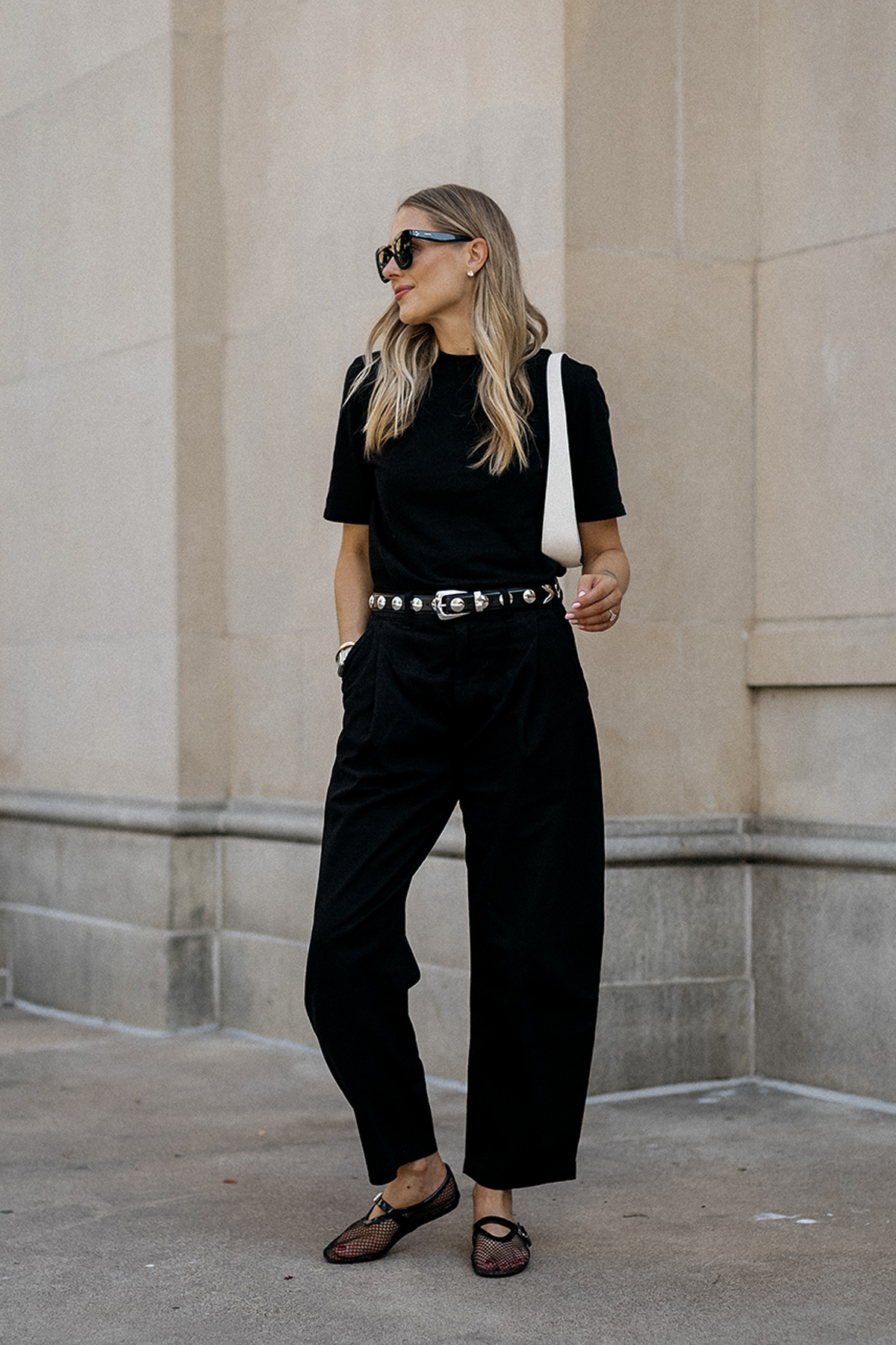 Fashion Jackson Wearing Black Tshirt AGOLDE Black Barrel Pants Amazon Black Mesh Flats Khaite Benny Studded Black Leather Belt The Row White Half Moon Bag Street Style 2