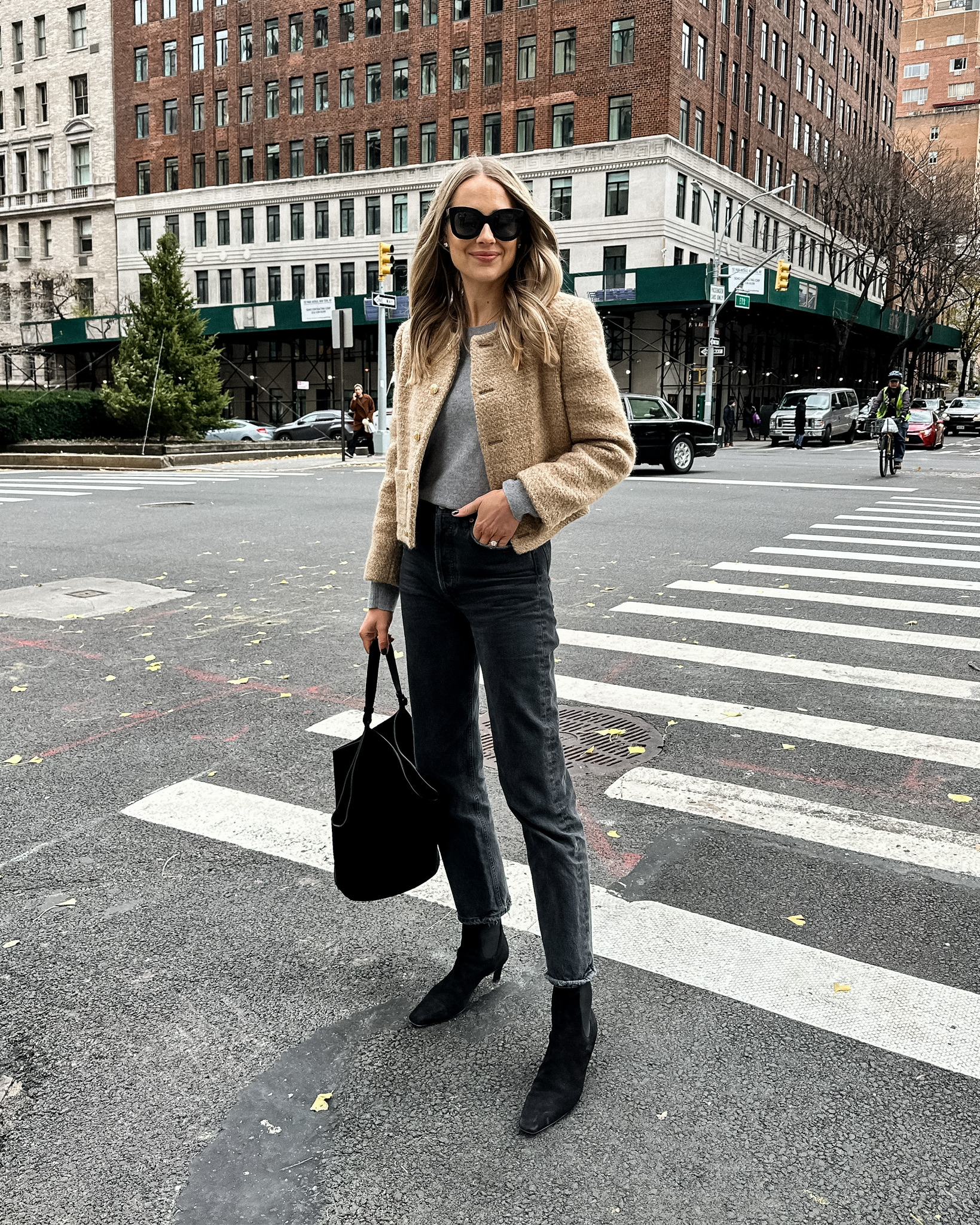 Fashion Jackson Wearing Celine Tan Tweed Lady Jacket Grey Sweater AGOLDE Black 90s Jeans Toteme Black Suede Booties Khaite Black Suede Lotus Handbag Fall Outfit New York Street Style