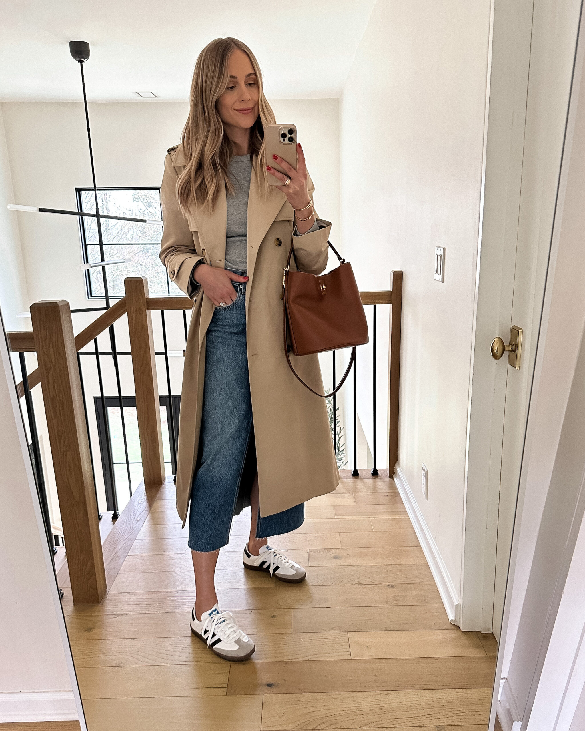 Fashion Jackson Wearing Mango Long Trench Coat Grey Long Sleeve Tee Denim Midi Skirt Adidas OG White Sambas Celine Triomphe Bucket Bag Spring Capsule Wardrobe