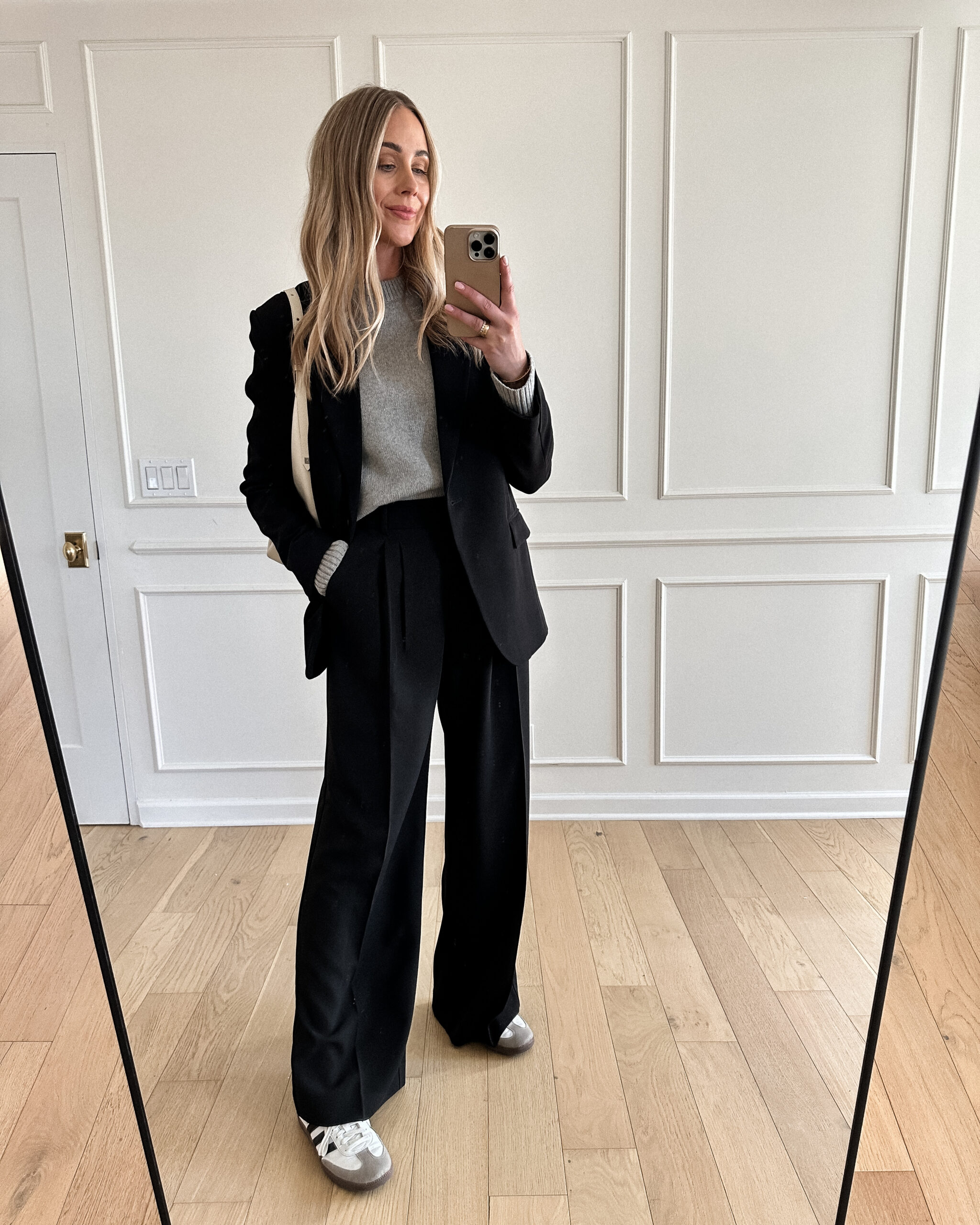 Fashion Jackson Wearing MAYSON the label black boyfriend blazer, grey sweater, MAYSON the label black trousers, samba sneakers, black blazer and sneakers outfit, black blazer outfit casual, casual workwear outfit for women, black blazer outfit inspo