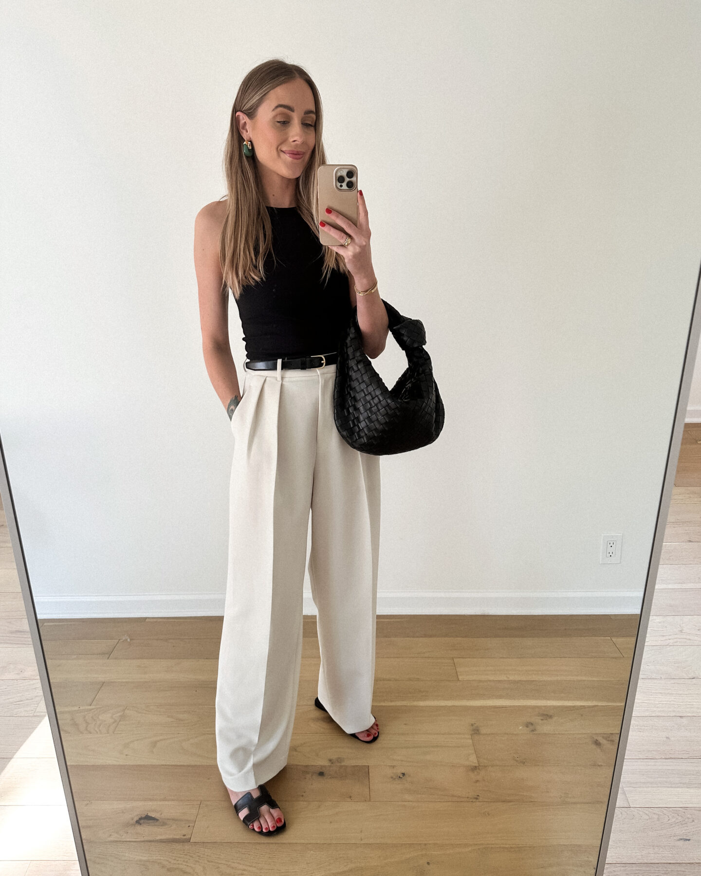 Fashion Jackson Wearing Black Rib Tank Beige Wide Leg Trousers Black Hermes Sandals Black Belt Black Bottega Teen Jodie Handbag Summer Outfit