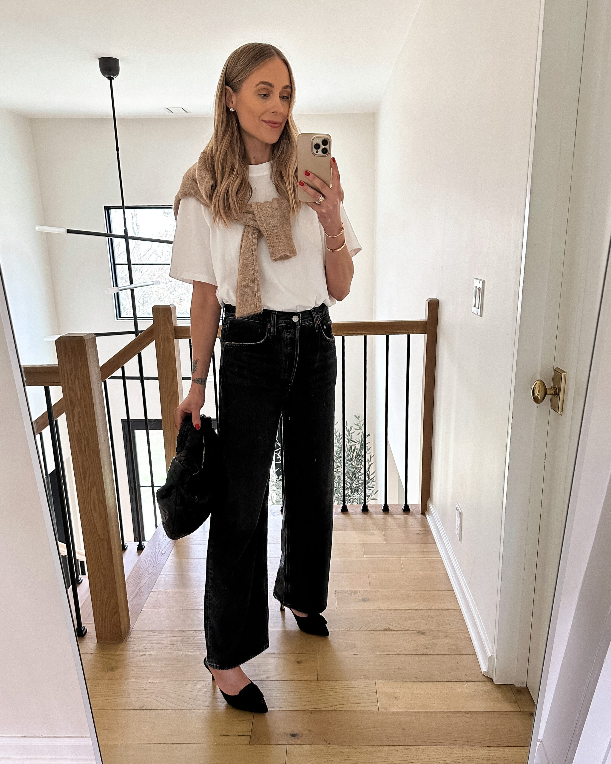 Fashion Jackson Wearing Relaxed White Tshirt Jenni Kayne Cardigan AGOLDE Black Slouchy Jeans Black Mules Bottega Veneta Black Teen Jodie Handbag Spring Capsule Wardrobe