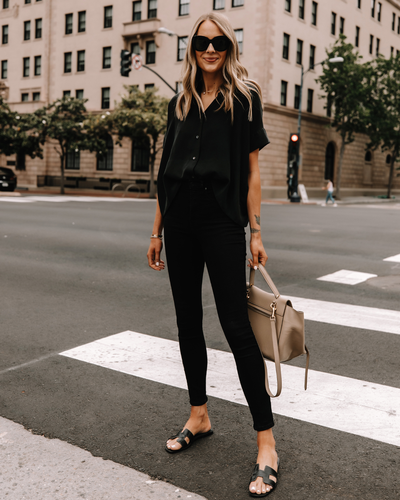 Fashion Jackson Wearing Everlane Black Button Down Shirt Everlane Black Skinny Jeans Hermes Oran Black Sandals Celine Taupe Belt Bag Street Style 2