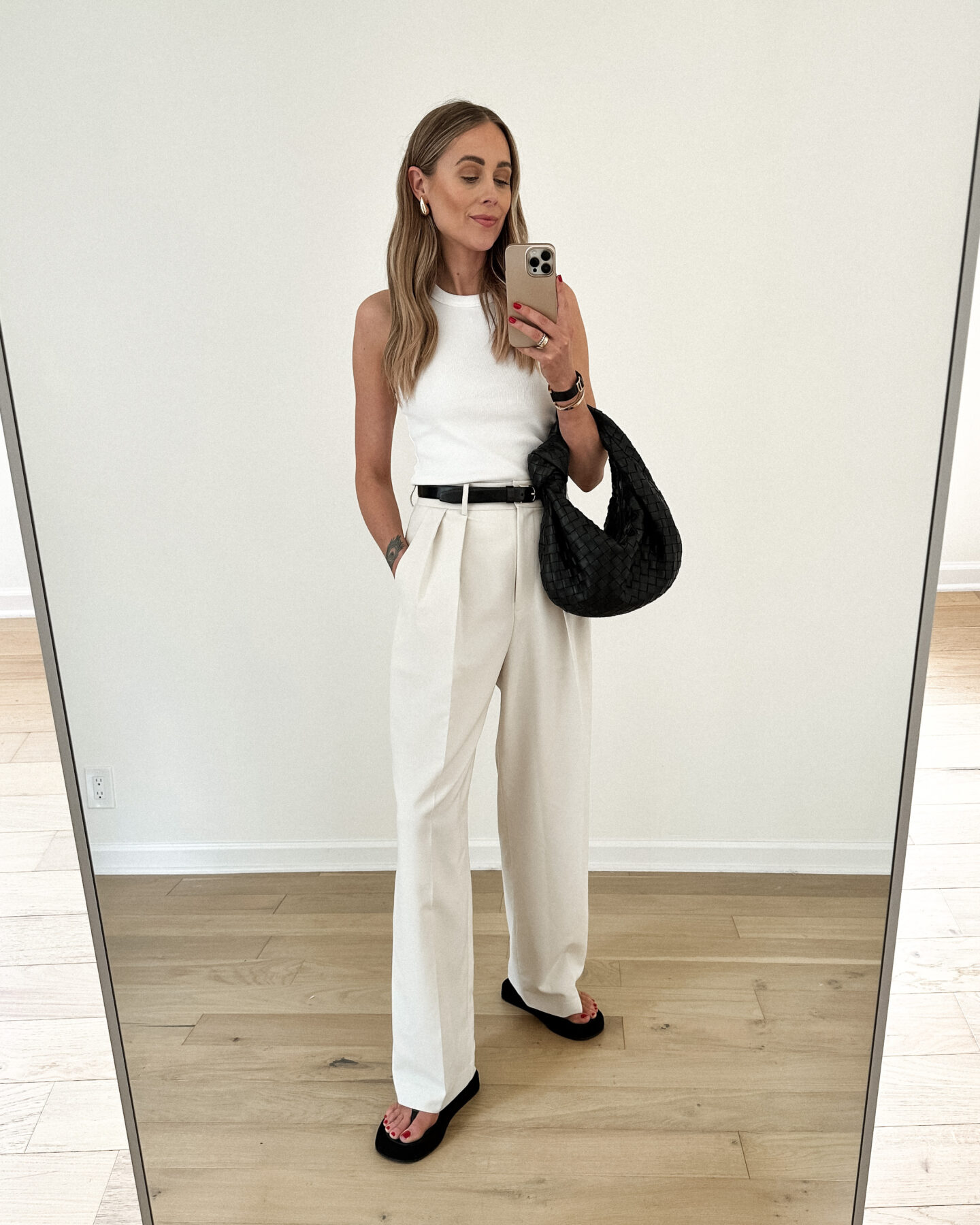 Fashion Jackson Wearing White Tank The Frankie Shop Corrin Ivory Wide Leg Pants The Row Ginza Black Sandals Bottega Veneta Jodie Teen Black Handbag Quiet Luxury Summer Outfit Street Style 1