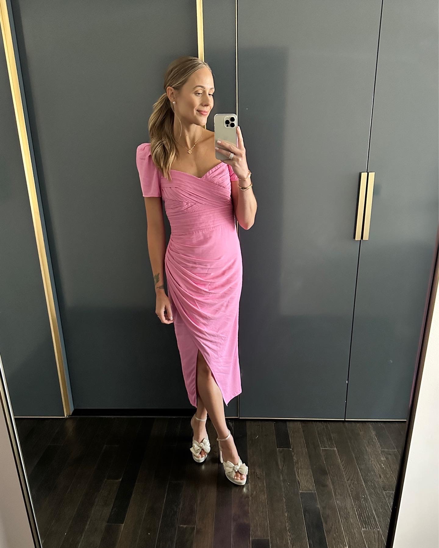 Fashion Jackson wearing pink midi cocktail dress, platform sandals