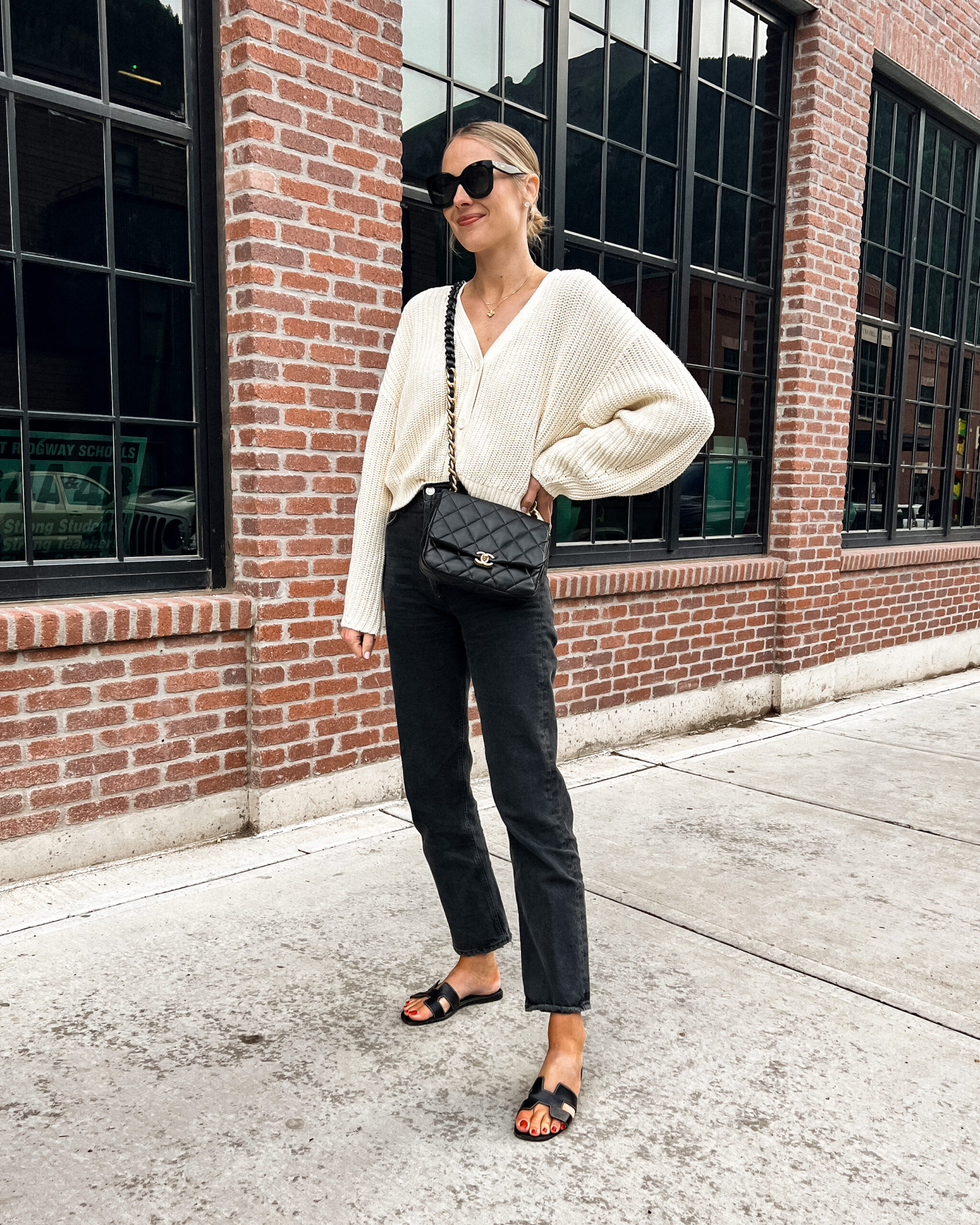 Fashion Jackson Wearing Ivory Cardigan Black AGODLE Jeans Hermes Black Sandals Telluride Fall Outfit