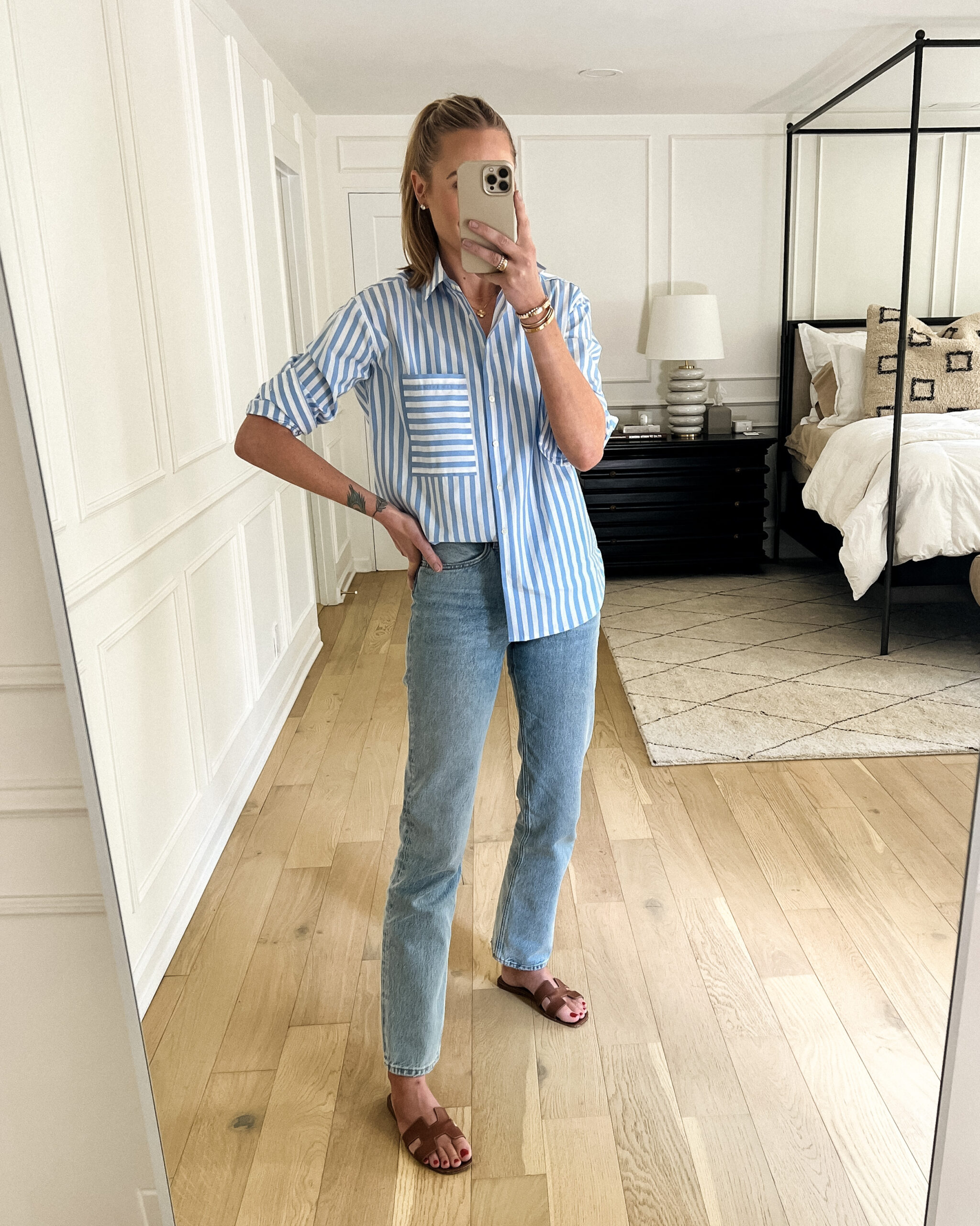 Fashion Jackson Wearing AYR Blue White Striped Shirt AGOLDE Jeans Hermes Oran Gold Sandals