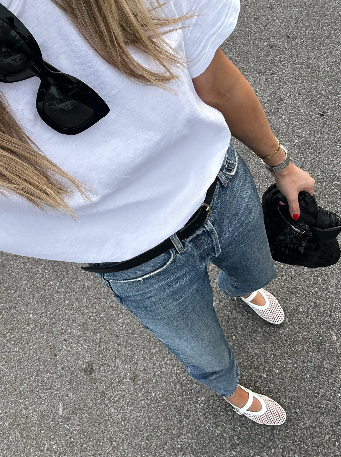 Fashion Jackson wearing white t-shirt, AGOLDE jeans, white mesh fishnet flats, casual spring outfit