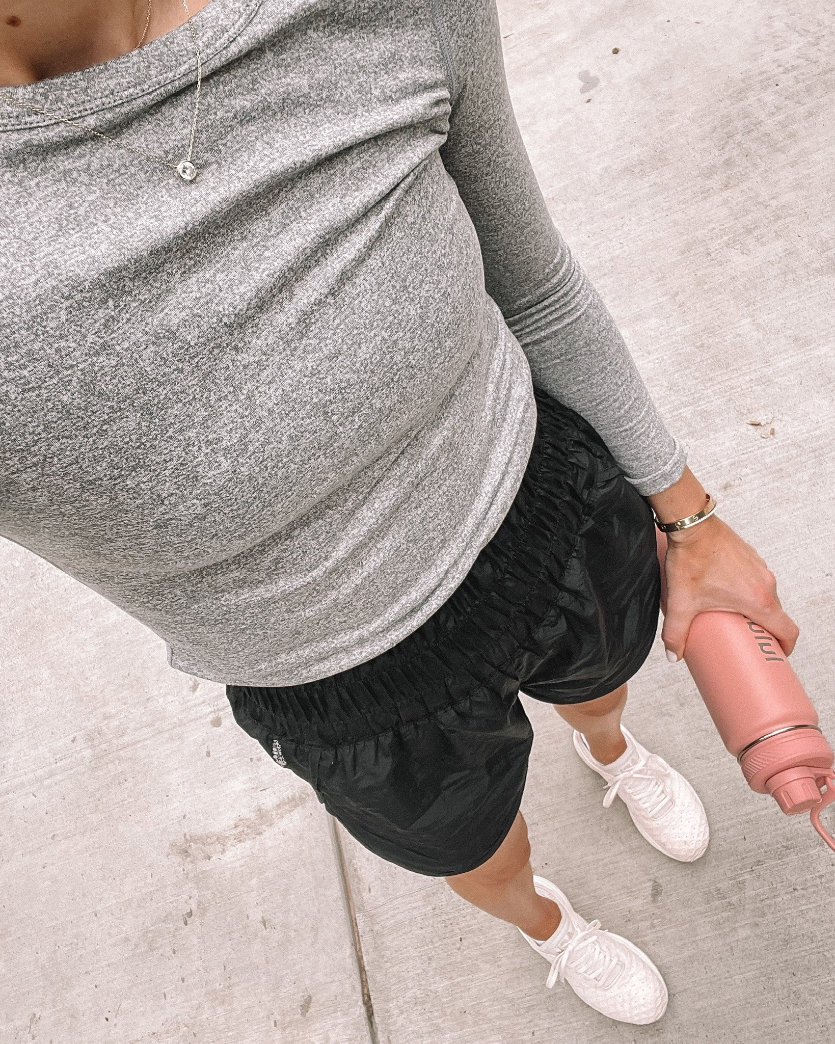 Fashion Jackson Wearing Long Sleeve Grey Workout Top Free People Black Workout Shorts APL Sneakers Pink lululemon Water Bottle