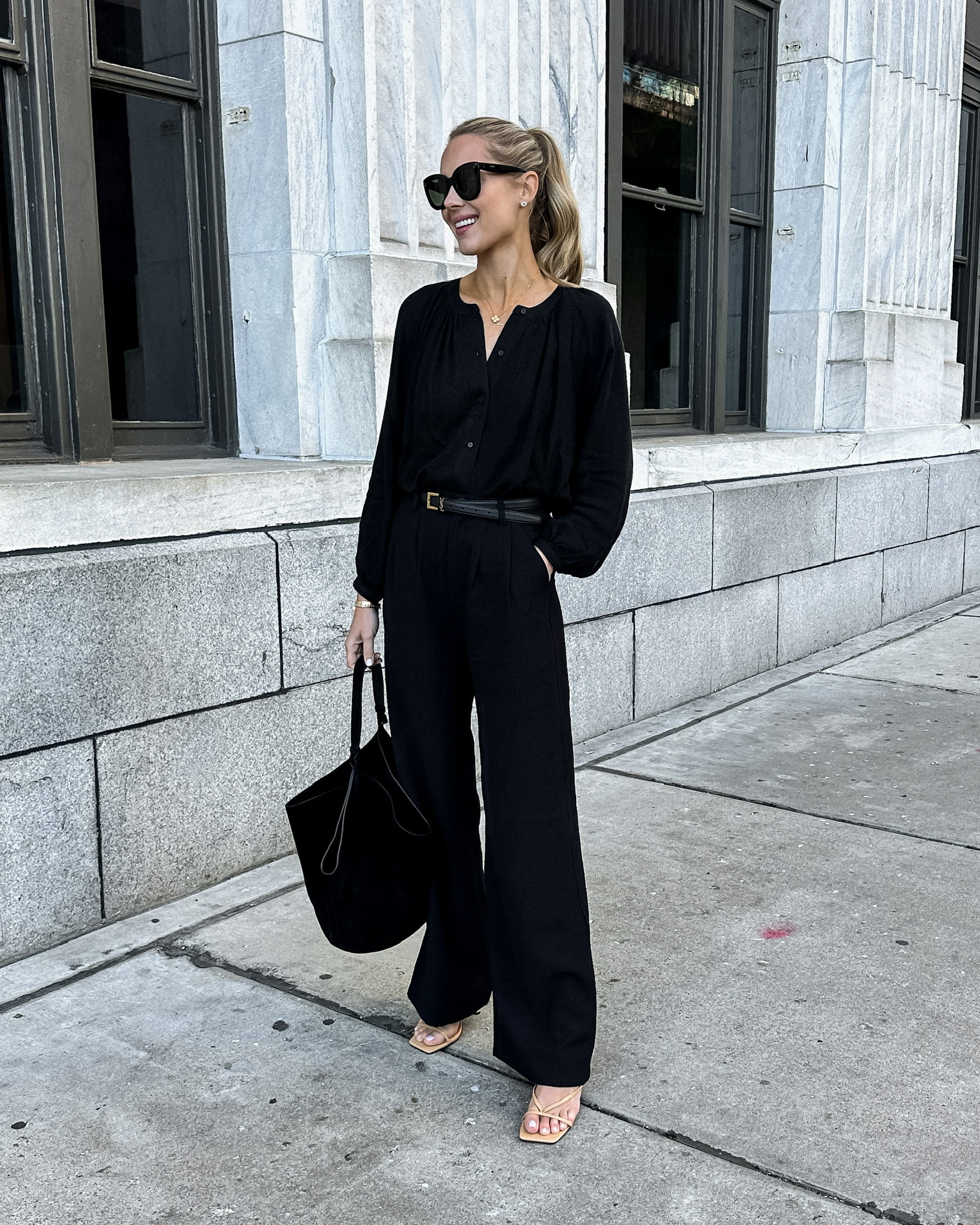 Fashion Jackson Wearing Jenni Kayne Black Peasant Blouse Black Wide Leg Pants Tan Sandals Khaite Medium Lotus Handbag Black Suede