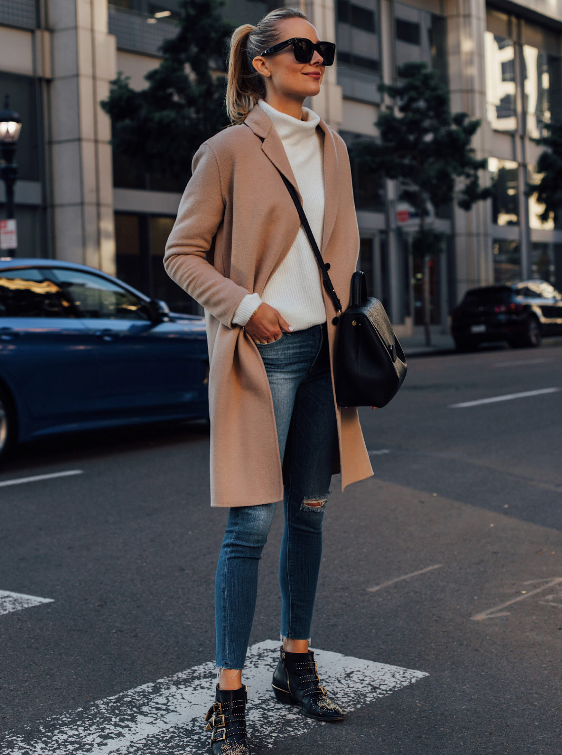 Blonde Woman Wearing AllSaints Camel Coat White Sweater Hudson Denim Ripped Skinny Jeans Chloe Black Susanna Booties Black Handbag Fashion Jackson San Diego Fashion Blogger Street Style