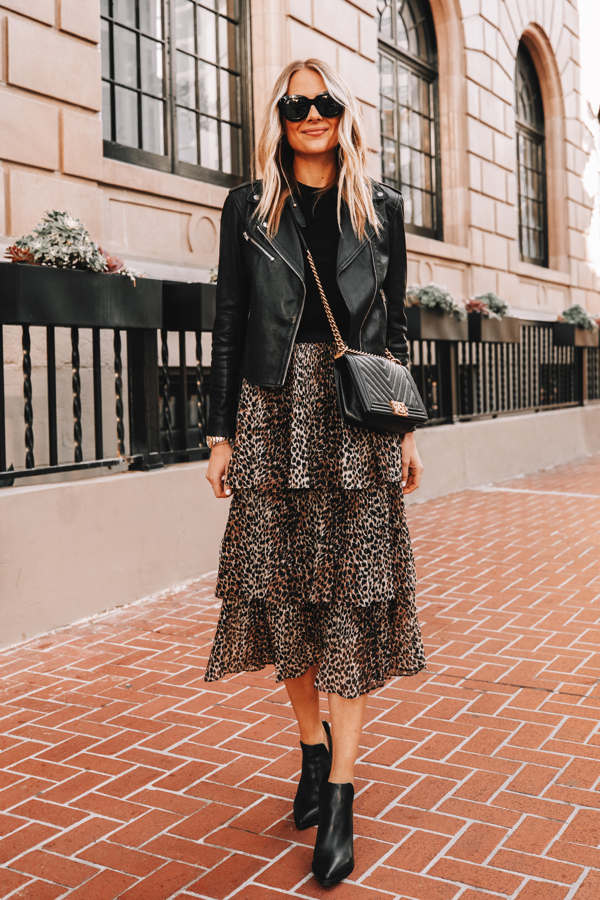 Fashion Jackson Wearing Black Leather Jacket Black Sweater Topshop Leopard Tiered Midi Skirt Black Booties