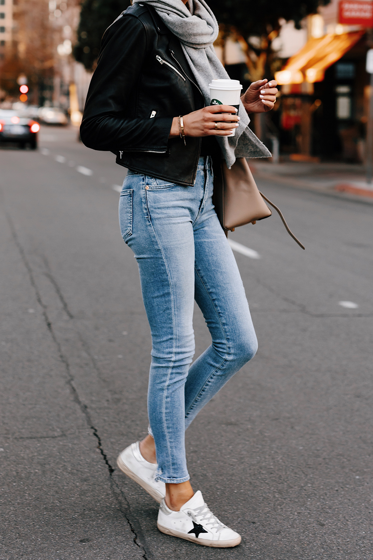 Woman Wearing Black Leather Jacket Grey Scarf Denim Skinny Jeans Golden Goose Sneakers Fashion Jackson San Diego Fashion Blogger Street Style