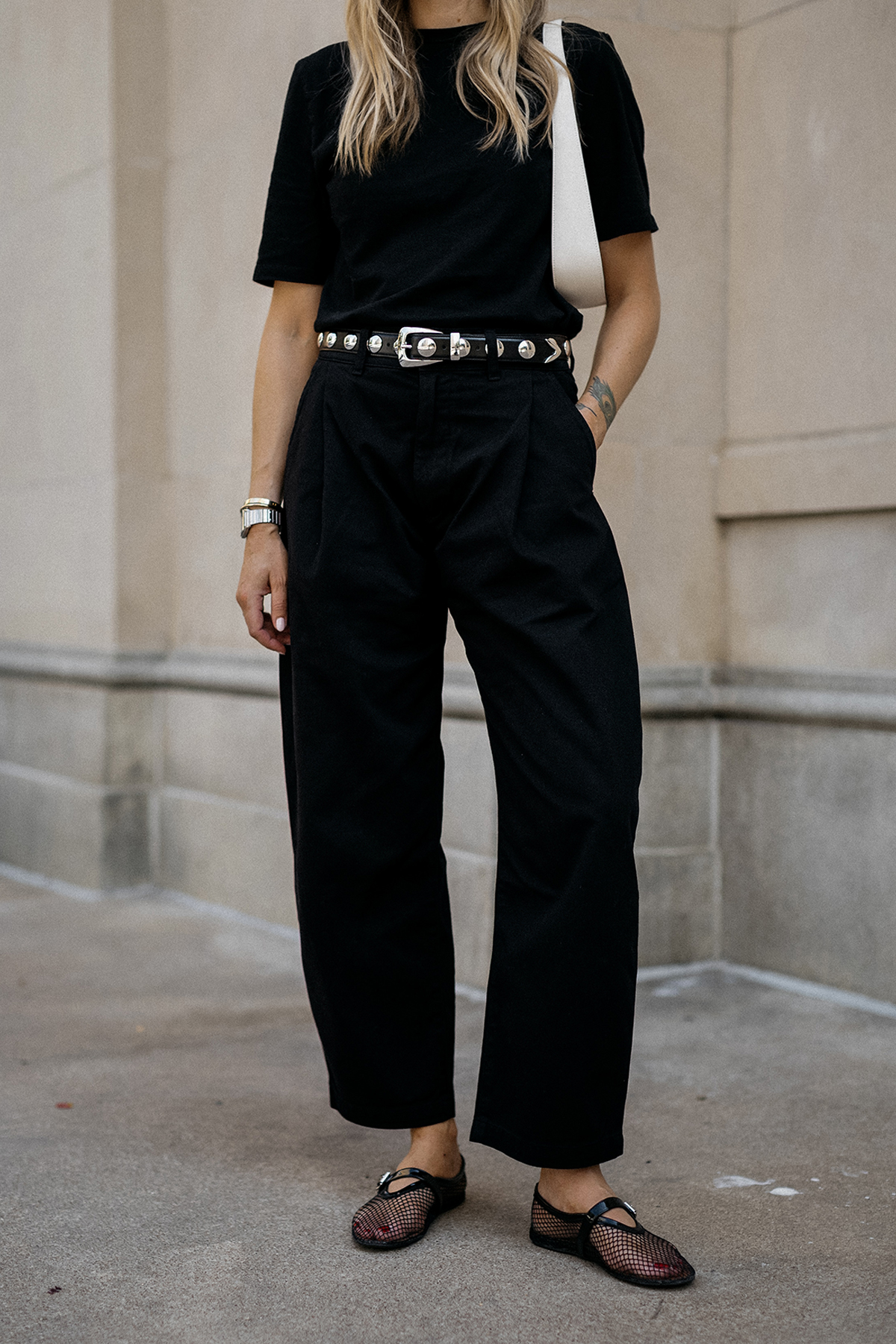 Fashion Jackson Wearing Black Tshirt AGOLDE Black Barrel Pants Amazon Black Mesh Flats Khaite Benny Studded Black Leather Belt The Row White Half Moon Bag