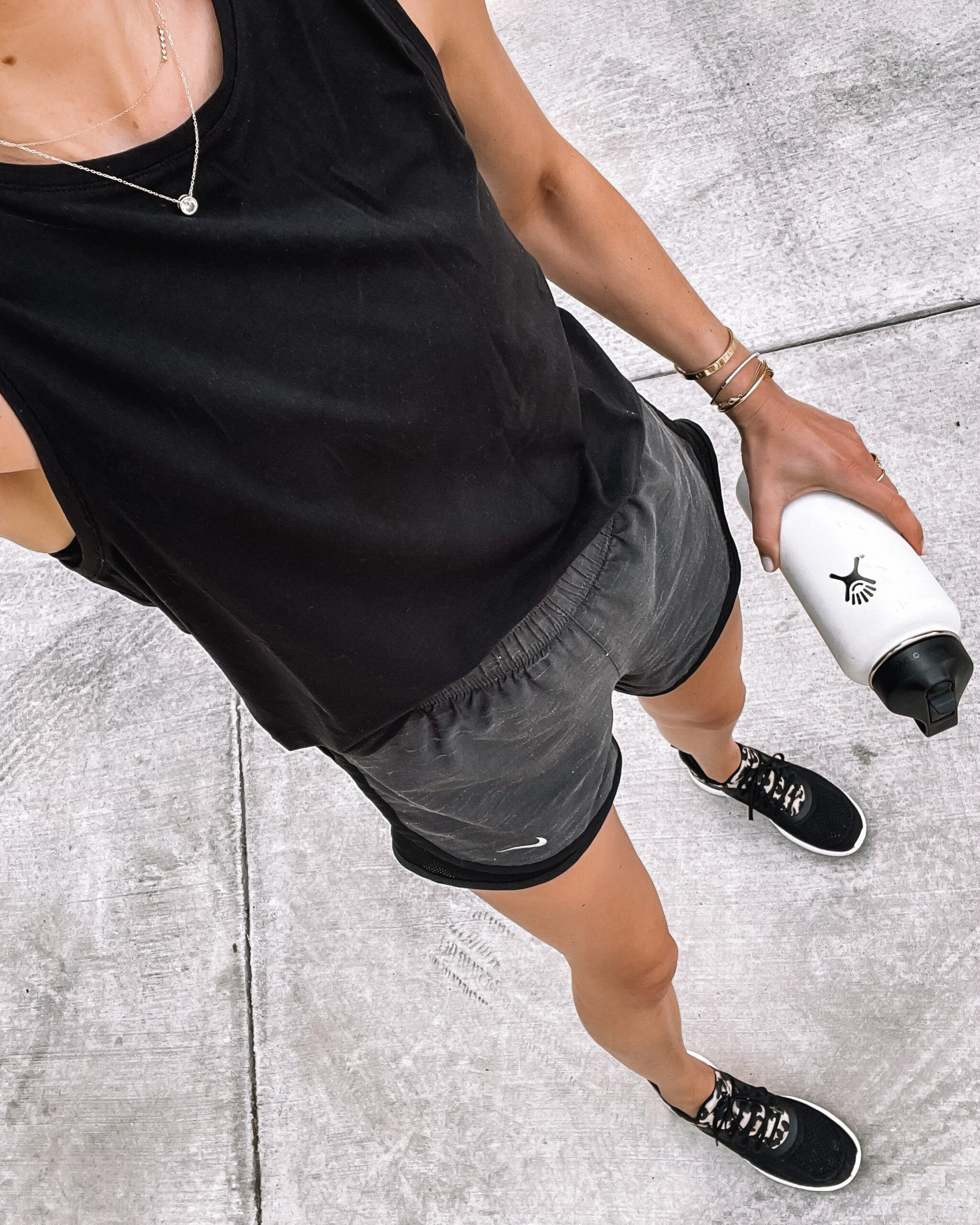 Fashion Jackson Wearing Black Workout Tank Nike Running Shorts with Liner APL Black Leopard Sneakers White Hydroflask Womens Workout Outfit