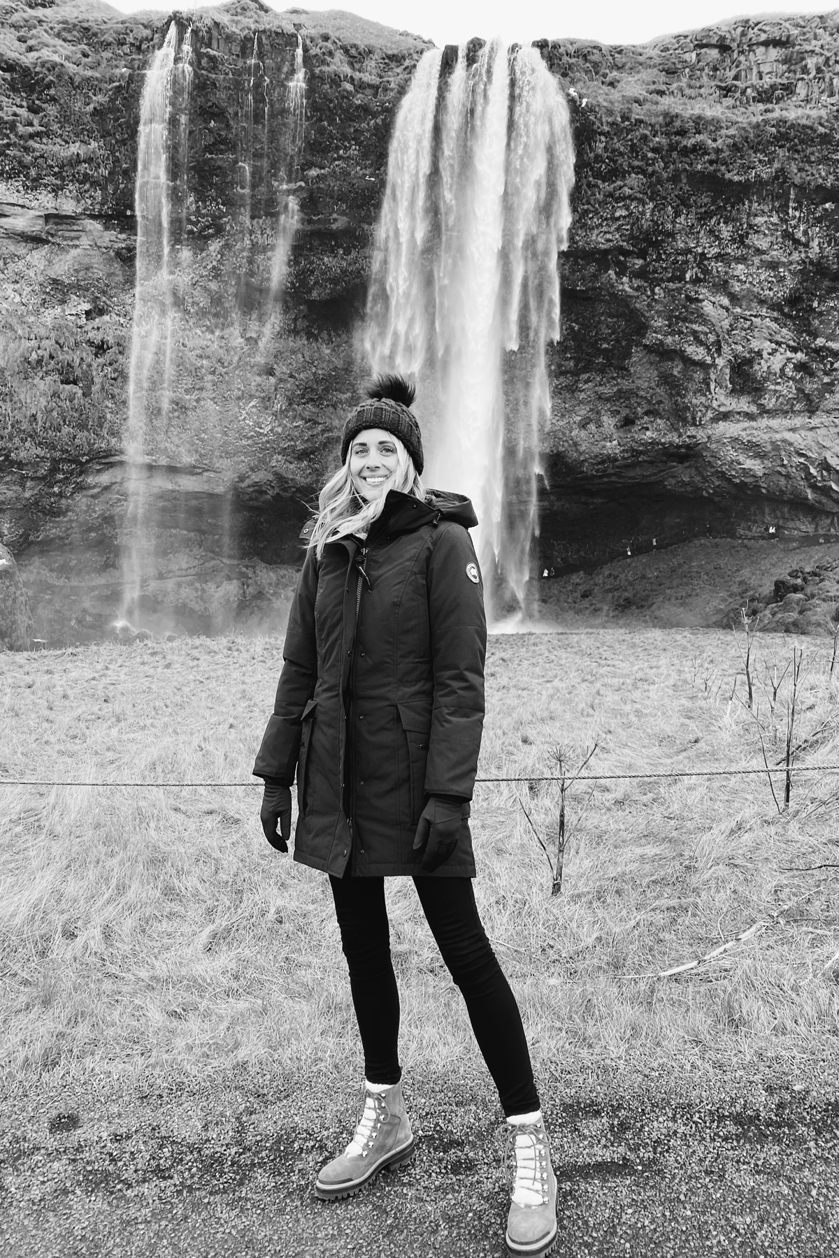 Fashion Jackson Wearing Canada Goose Black Jacket Winter Boots Black Beanie Waterfall Iceland Itinerary Travel Guide