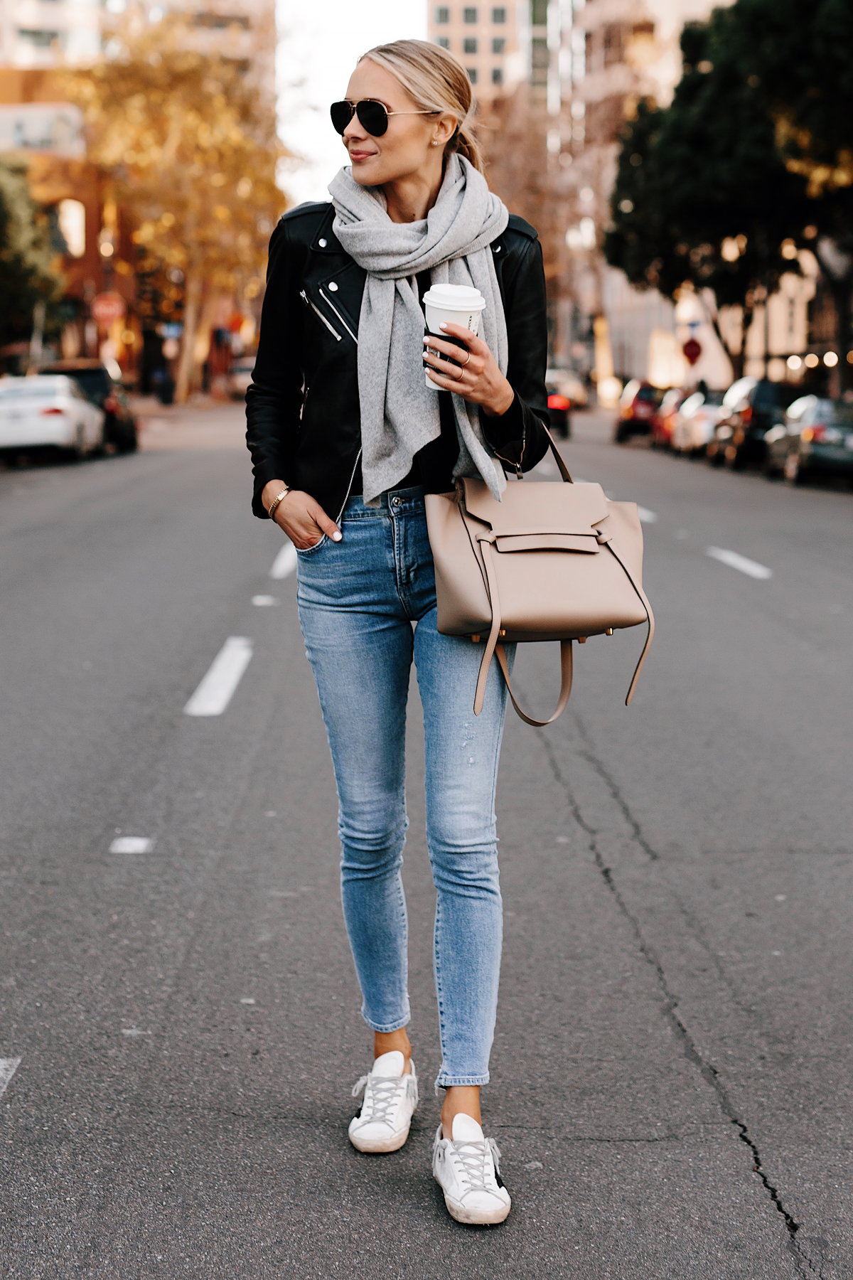 Blonde Woman Wearing Club Monaco Black Leather Jacket Grey Scarf Denim Skinny Jeans Golden Goose Sneakers Celine Mini Belt Bag Fashion Jackson San Diego Fashion Blogger Street Style