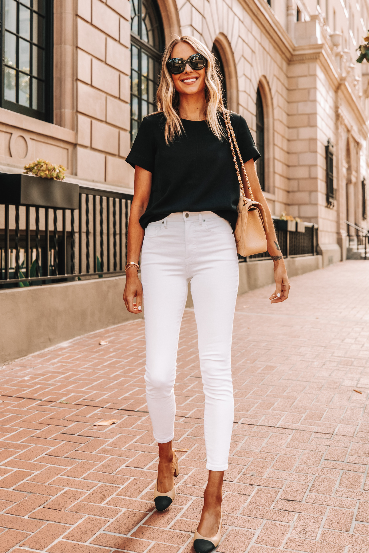 Fashion Jackson Wearing Everlane Black Short Sleeve Top Everlane White High Rise Skinny Jeans Chanel Slingbacks 1