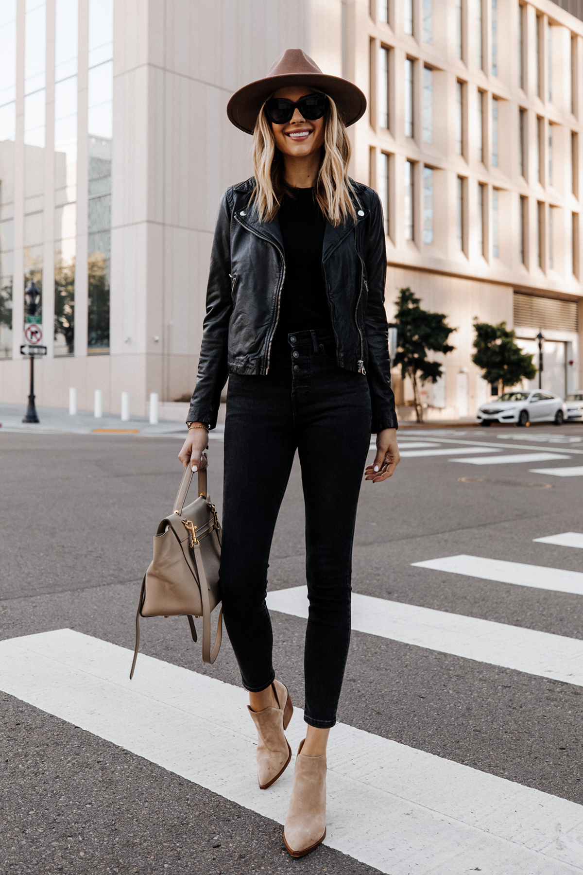 Fashion Jackson Wearing Madewell Black Leather Jacket Black Jeans Vince Camuto Gigetta Tan Suede Booties Tan Wide Brim Hat 2