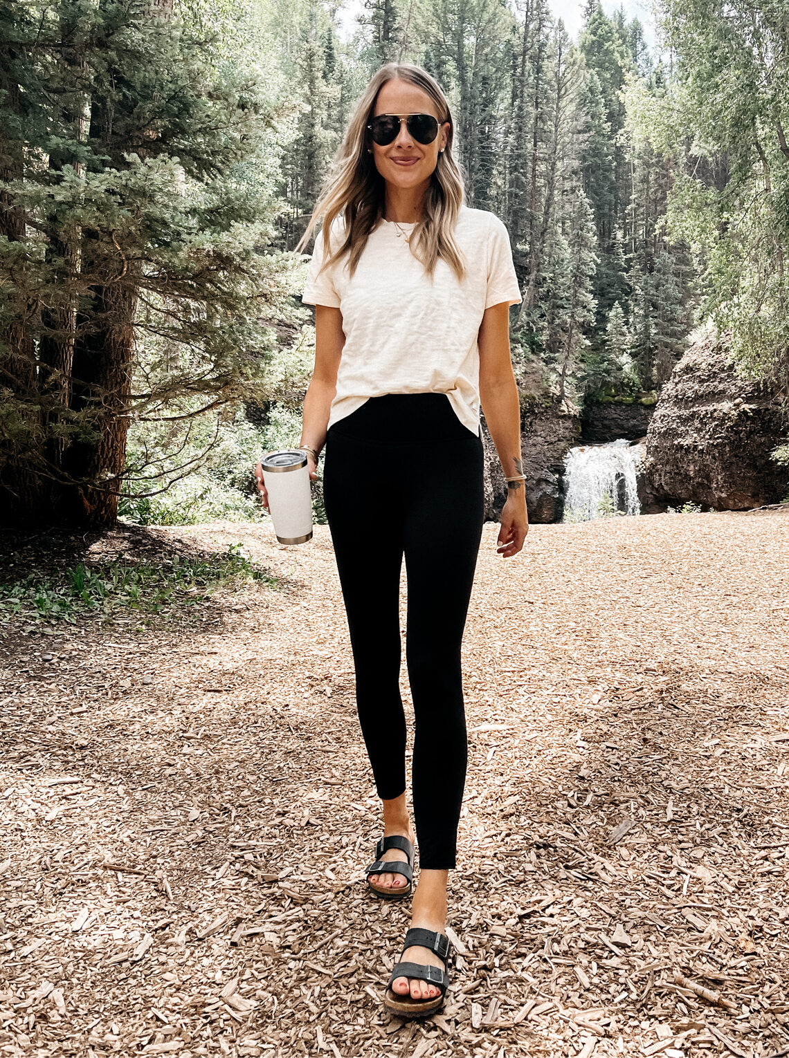 Fashion Jackson Wearing Vuori Tee Vuori Black Leggings Black Birkenstock Sandals