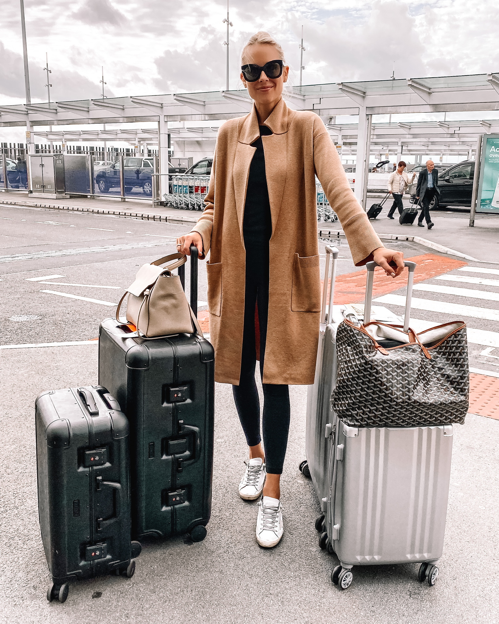 Fashion Jackson Wearing Camel Coatigan Black Leggings Golden Goose Sneakers Calpak Luggage Goyard Tote Airport Outfit Travel Style