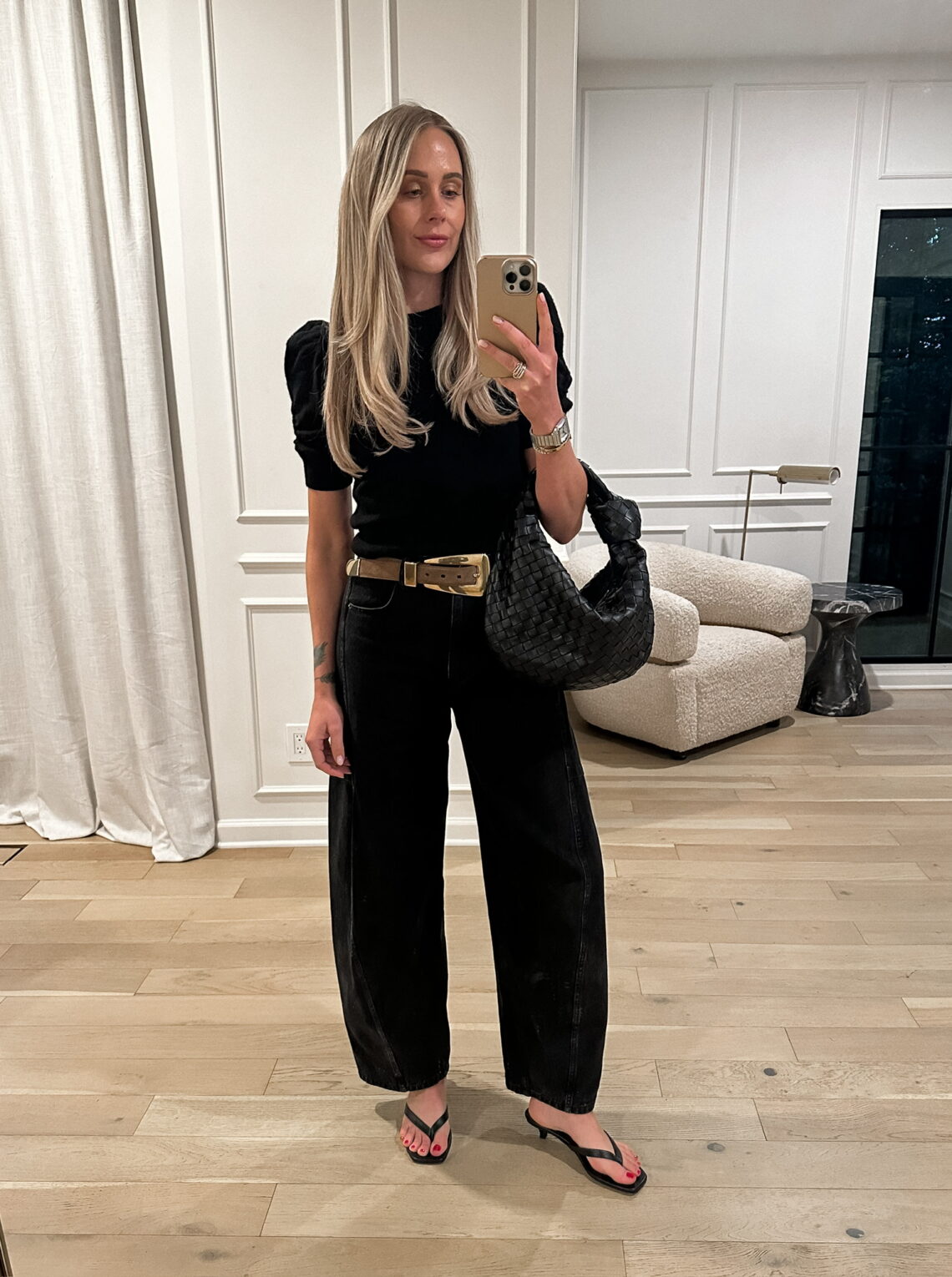 Fashion Jackson wearing black Tibi jeans, FRAME ruched top, black sandals, summer night outfit