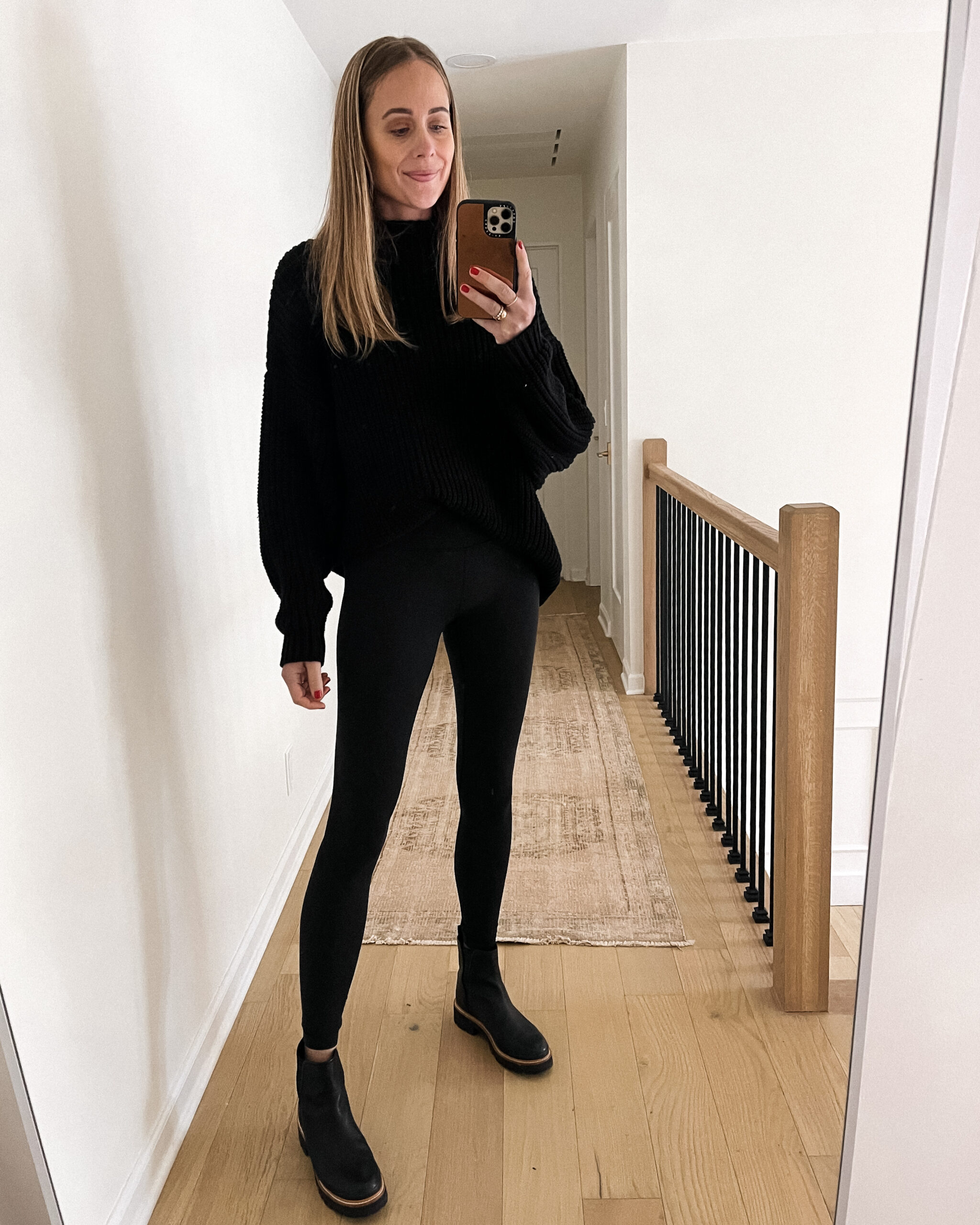 Fashion Jackson Wearing Free People Black Sweater Black Leggings Black Lug Sole Boots