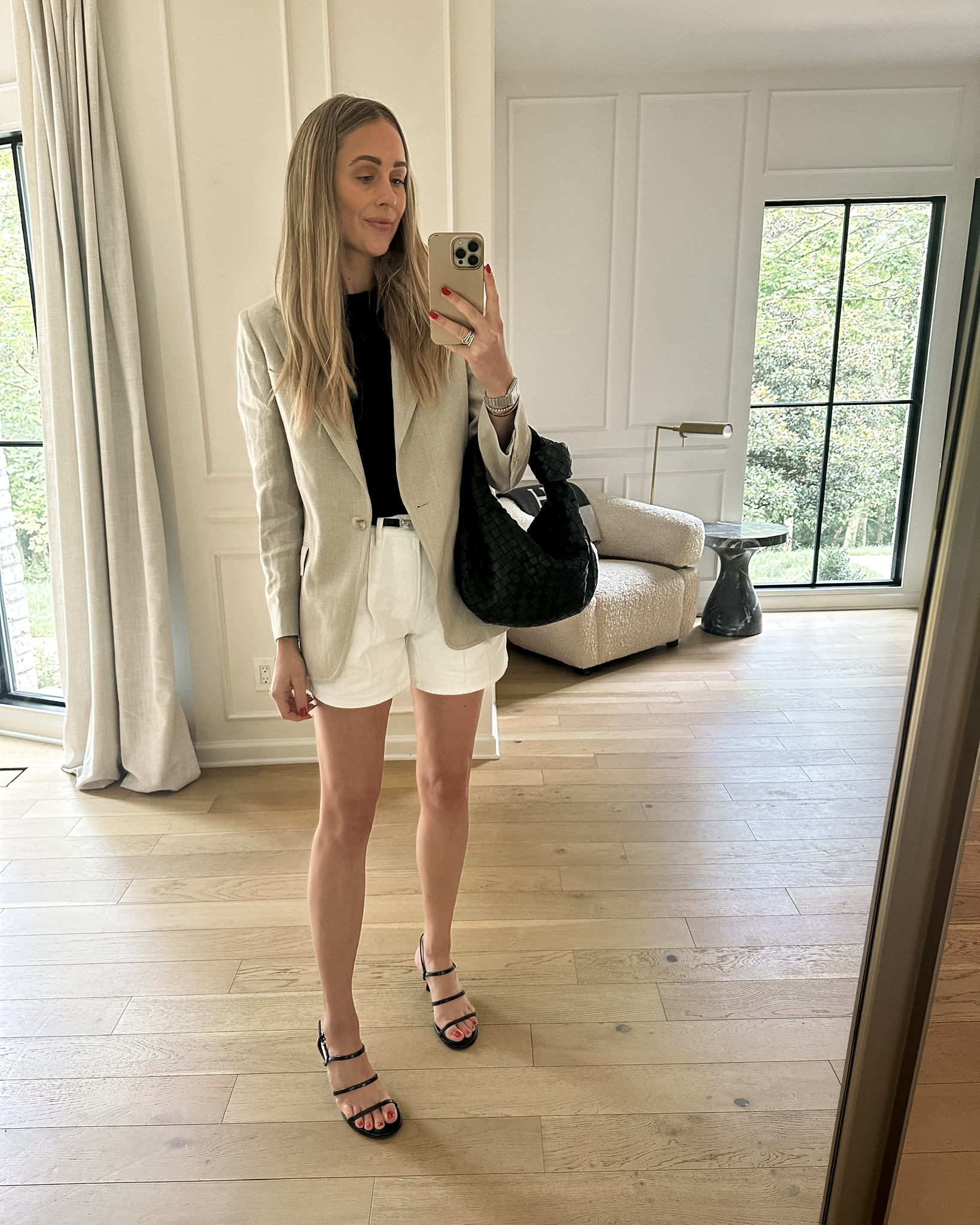 Fashion Jackson wearing Reiss Linen Blazer, Toteme Black Belt, Veronica Beard White Pleated Shorts, Summer Outfit