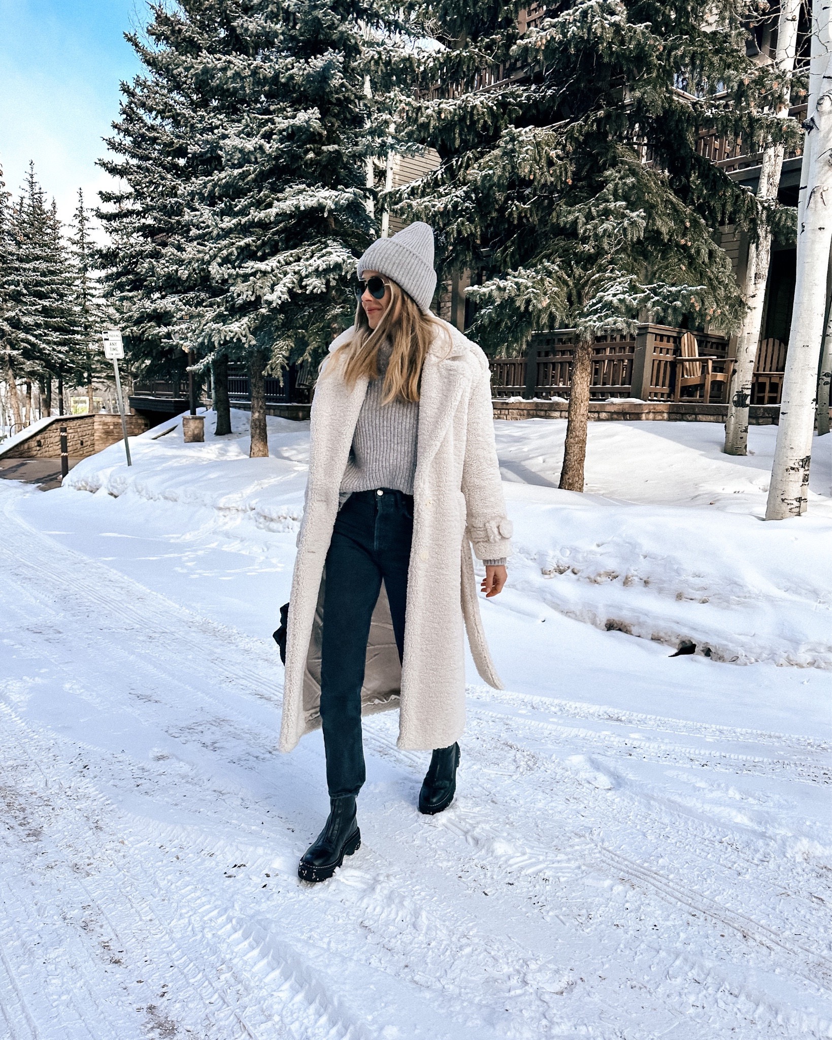 Fashion Jackson Wearing White Teddy Coat Grey Sweater Black Jeans Black Boots Grey Beanie Telluride Winter Outfit