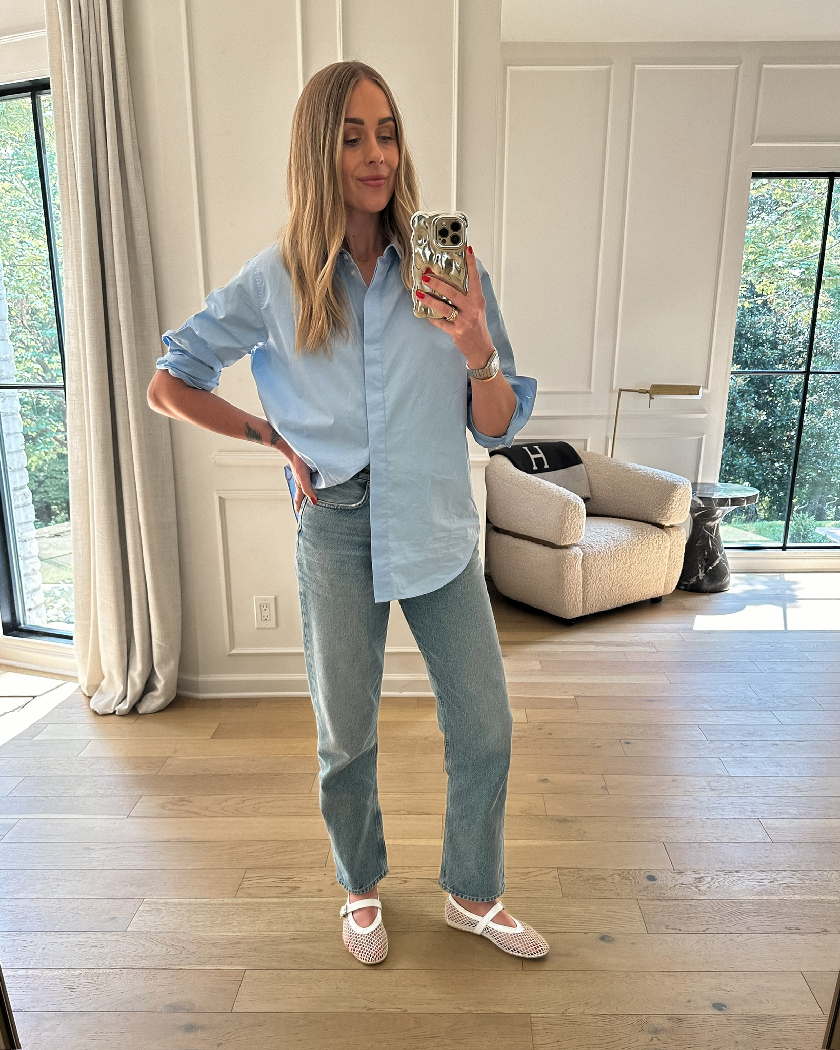 Fashion Jackson wearing MAYSON the label blue button up shirt, AGOLDE jeans, mesh flats