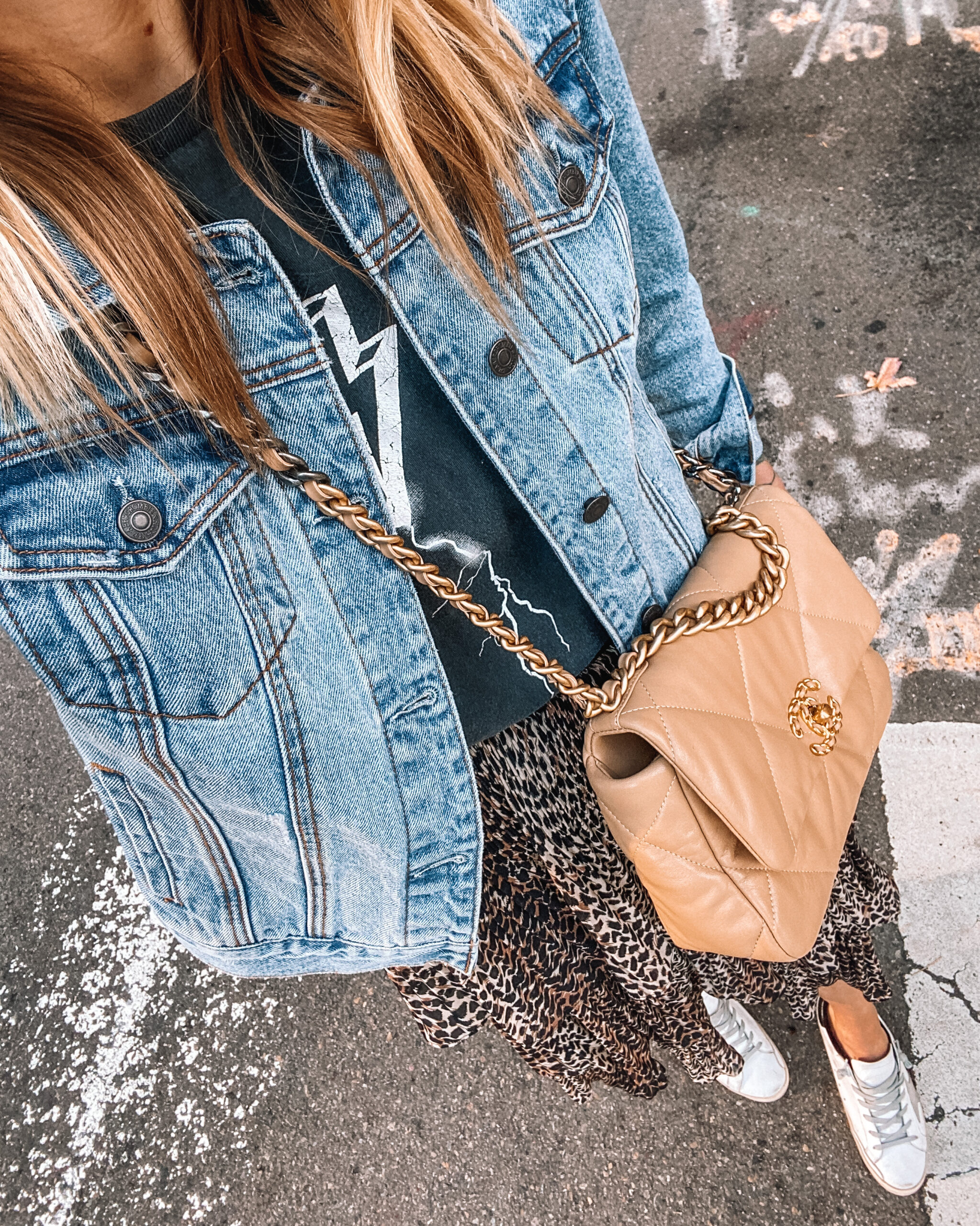 Fashion jackson Wearing denim jacket leopard midi skirt anine bing graphic tshirt golden goose sneakers