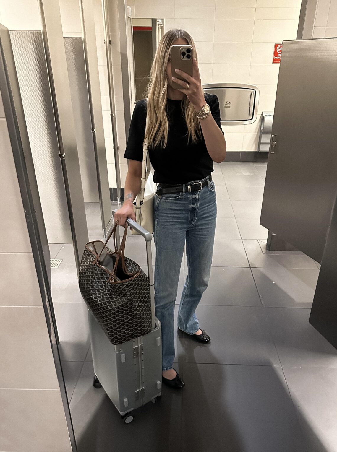 Fashion Jackson Wearing Black Tshirt Khaite Danielle Jeans Chanel Black Ballet Flats Travel Outfit Amazon Luggage Goyard Tote