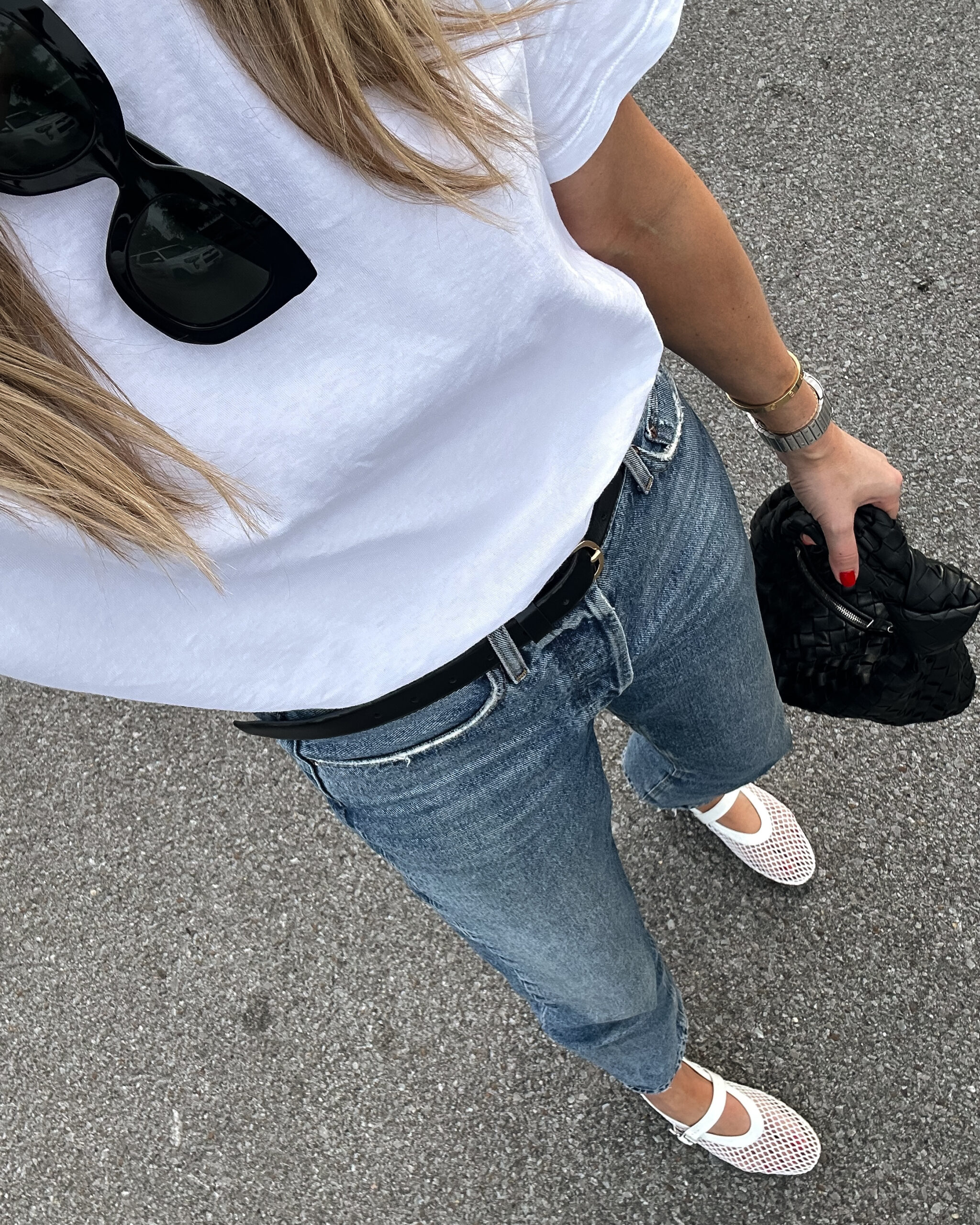 Fashion Jackson wearing white t-shirt, AGOLDE jeans, white mesh fishnet flats, casual spring outfit