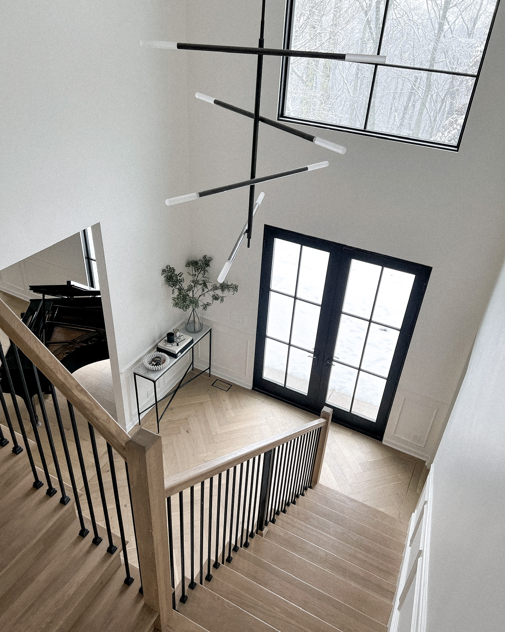 Fashion Jackson Transitional Interior Design Entryway Chevron Wood Floors Kelly Wearstler Light Fixture