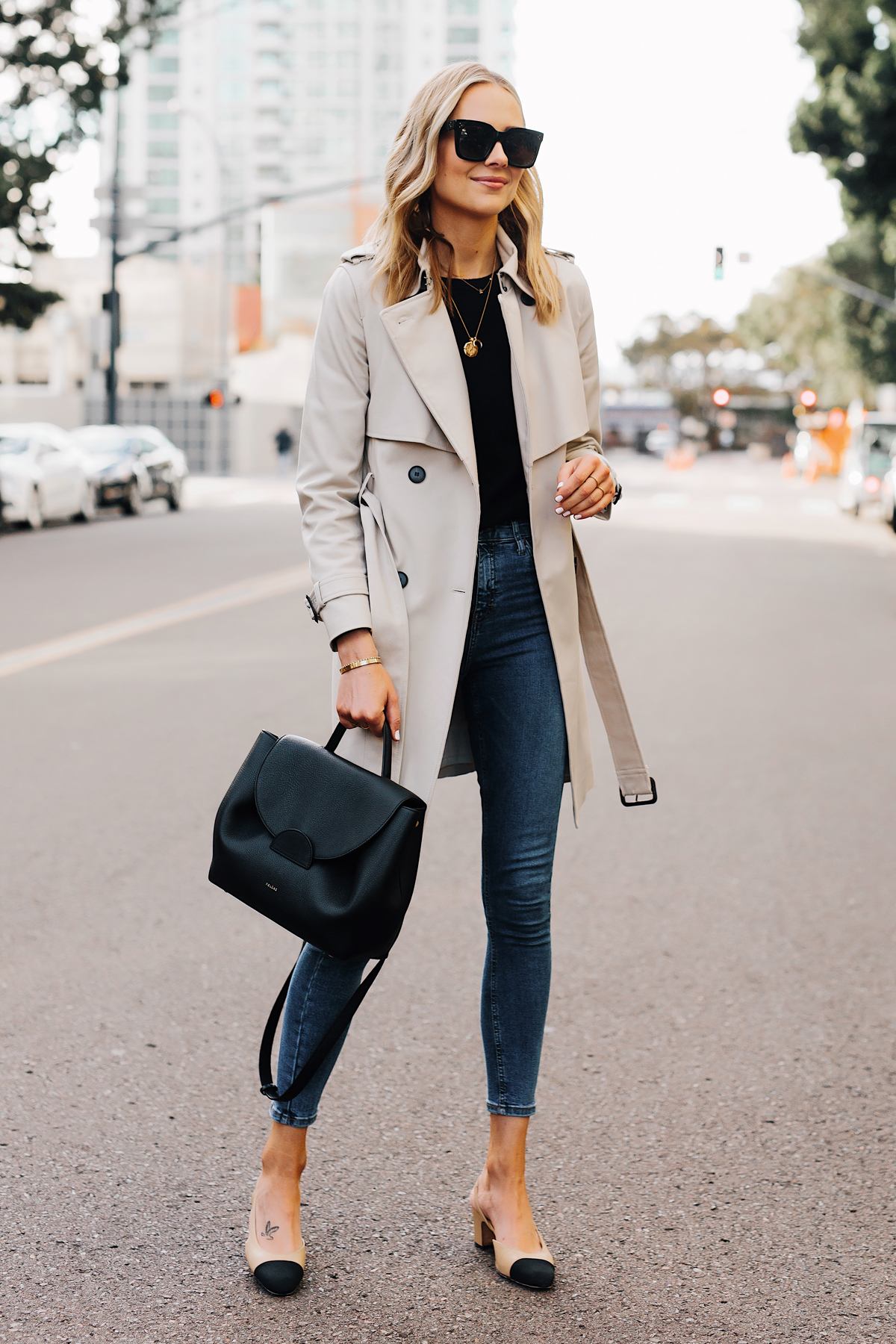 Blonde Woman Wearing Trench Coat Black Sweater Denim Skinny Jeans Chanel Slingbacks Polene Number One Handbag Monochrome Black Fashion Jackson San Diego Fashion Blogger Street Style