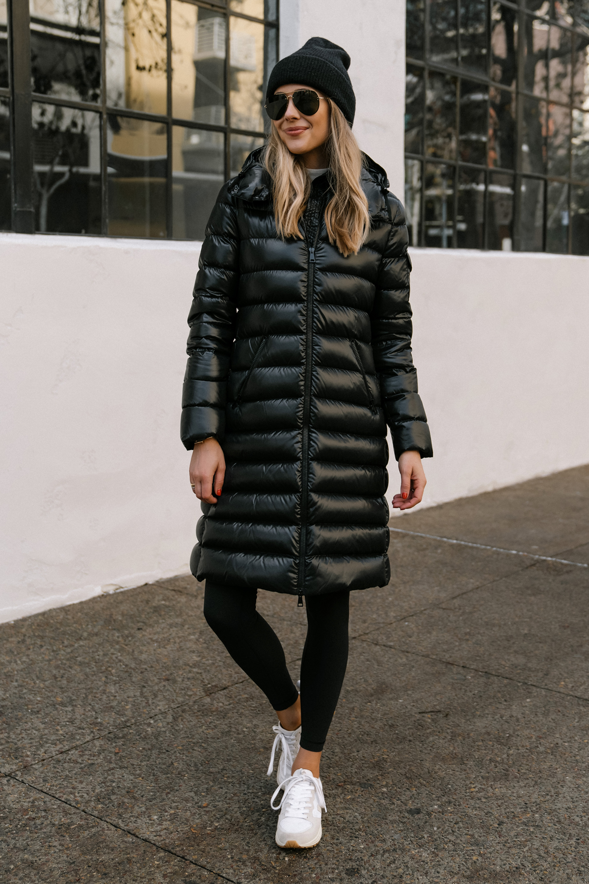 Fashion Jackson Wearing Black Moncler Moka Quilted Down Long Parka Black Leggings Veja Venturi Sneakers Black Beanie Celine Aviator Sunglasses Winter Coat Street Style